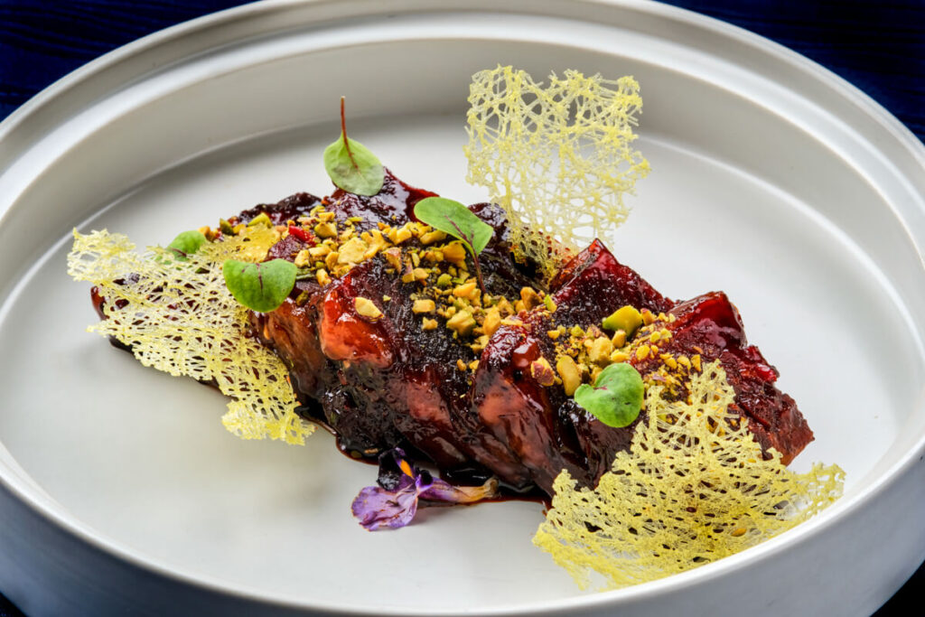 US premium beef short rib with honey sweet black vinegar sauce and pistachio