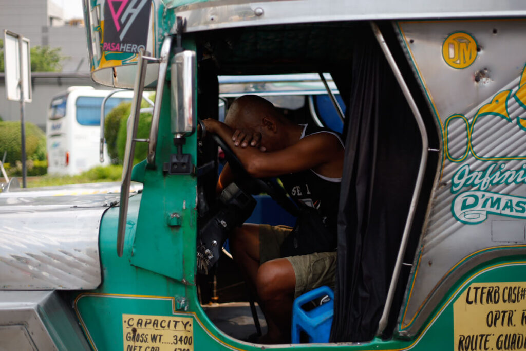 Grand Champion Von Cedrick Cunanan captures a jeepney driver resting in the midday heat